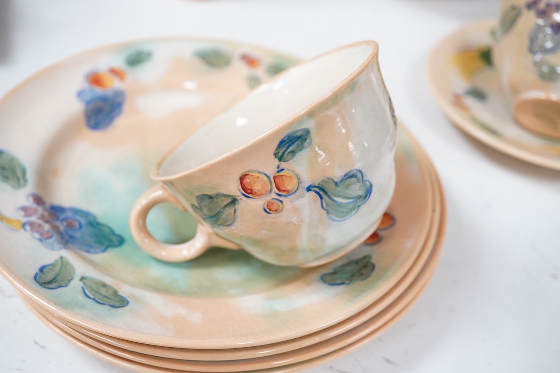 A collection of Doulton Brangwynware to include a bowl, two teacups and seven side plates, largest 34cm in diameter